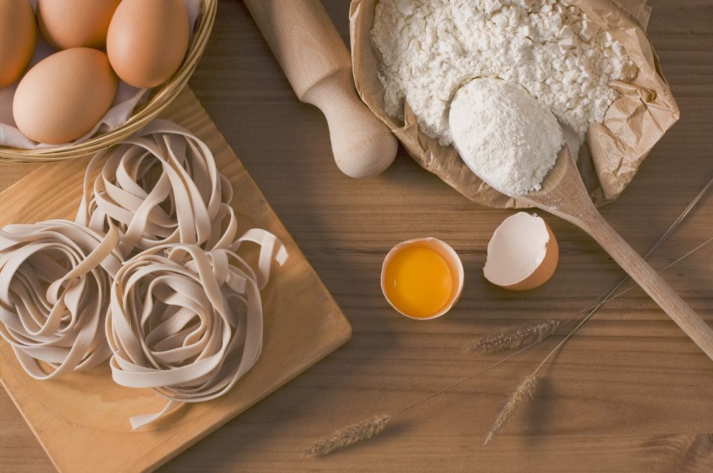 home made pasta ingredients laid aesthetically on a cutting board