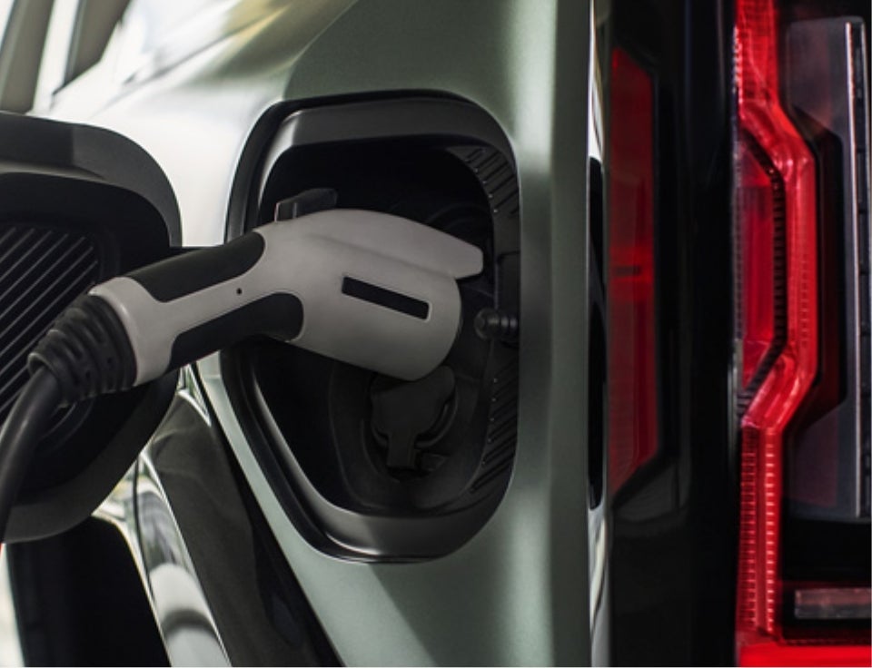Close up of charging port with charger plugged in on a GMC Hummer EV SUV - Allen Tillery Buick GMC in HOT SPRINGS AR