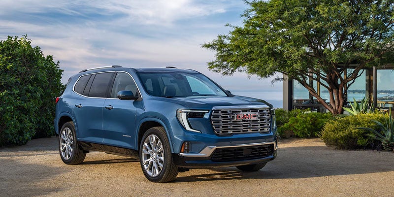 2027 GMC Acadia interior showing the second row and the 15-inch touchscreen