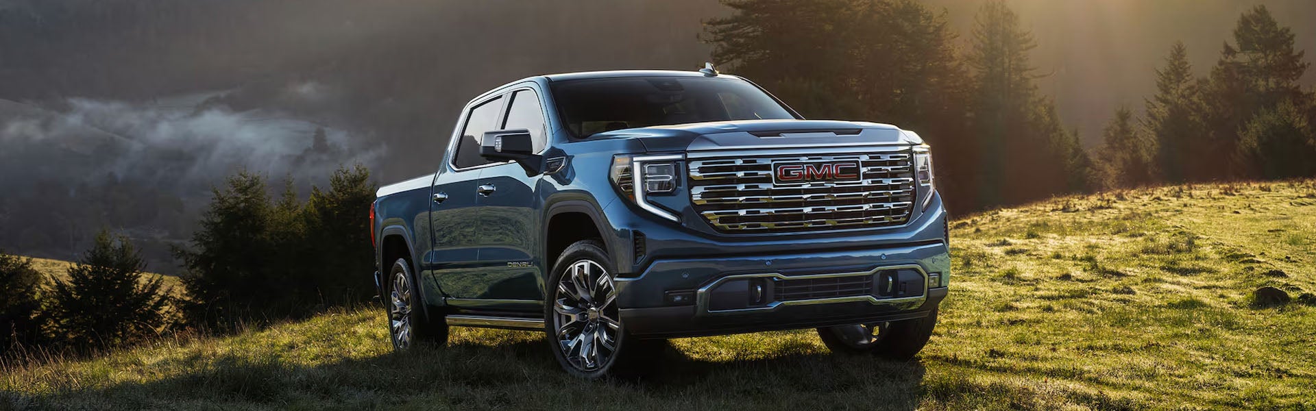 2026 GMC Sierra 1500 Crew Cab parked in front of an Arkansas dealership lot